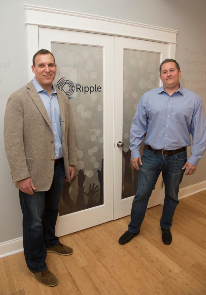 CELEBRITY STATUS: Mikko Passananti, left, CEO of Ripple, and Eric Maybaum, president, are seen in their Providence office. / PBN PHOTO/MICHAEL SALERNO