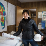 Finding sports equality BUILDING IT FORWARD: Margaret "Digit" Murphy takes a moment in a construction trailer at the New England Sports Village site in Attleboro, a $53 million complex that will include hockey rinks and offices for her mentoring enterprise, the Play It Forward Foundation. / PBN PHOTO/RUPERT WHITELEY