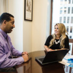 MAKING CONNECTIONS: Deborah Viveiros, vice president and associate relationship manager for Webster Bank, has used her native Rhode Island connections to drive business for the bank. Here she talks with Joe Monteiro, vice president, relationship manager business banking. / PBN PHOTO/RUPERT WHITELEY