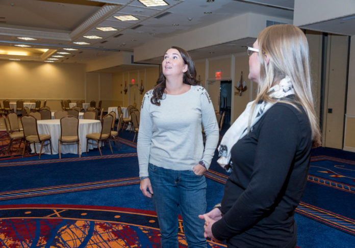 CURRENT EVENTS: Stephanie Frazier-Grimm, left, owner and founder of Couture Parties and The Confetti Foundation, meets with Mary Lynn Williams, event manager at the Newport Marriott. / PBN FILE PHOTO/MICHAEL SALERNO