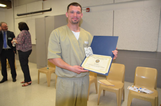 A FRESH START: John Adams, an inmate at the Adult Correctional Institutions, shows off his diploma from the Pivot the Hustle Career Readiness Program of Roger Williams University. The program provides contemporary workforce preparation for minimum-security inmates in work release. / COURTESY ROGER WILLIAMS UNIVERSITY SCHOOL OF CONTINUING STUDIES