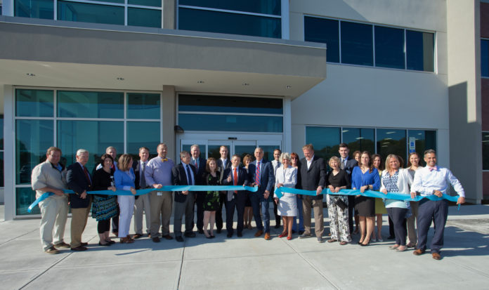 Business and civic leaders gather to cut the ribbon on South County Health’s newest Medical & Wellness Center / COURTESY BEAU JONES