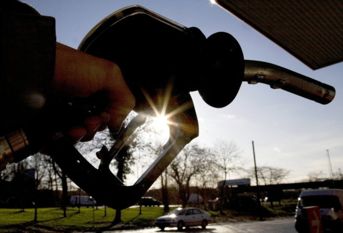 SELF-SERVE, regular gasoline prices fell in Rhode Island and Massachusetts this week, 2 cents and 6 cents, respectively, AAA Northeast said. / BLOOMBERG NEWS FILE PHOTO / CHRIS RATCLIFFE