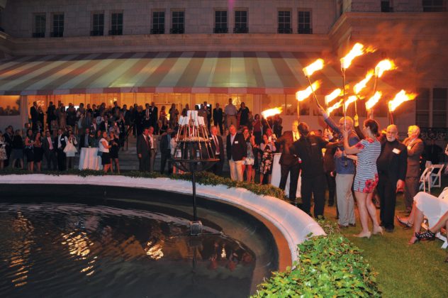 Lighting the torches for Waterfire  / Skorski Photography