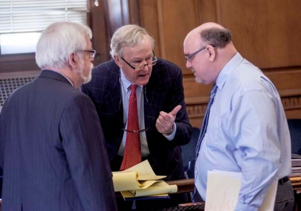 OFFENSE: Attorneys representing Providence retirees suing the city over pension and health care agreements that were altered during Mayor Angel Taveras' administration are seen in Rhode Island Superior Court on April 21. They are, from left, Stephen H. Burke, Thomas J. McAndrew and Kevin Bowen. / PBN PHOTO/MICHAEL SALERNO