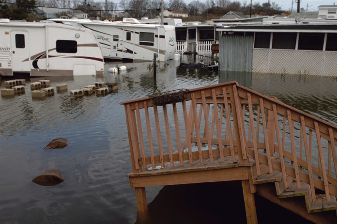 SIGN OF THINGS TO COME: A trailer park on Matunuck Beach Road in South Kingstown was flooded by the extreme weather brought by Superstorm Sandy in 2012. / PBN FILE PHOTO/BRIAN MCDONALD
