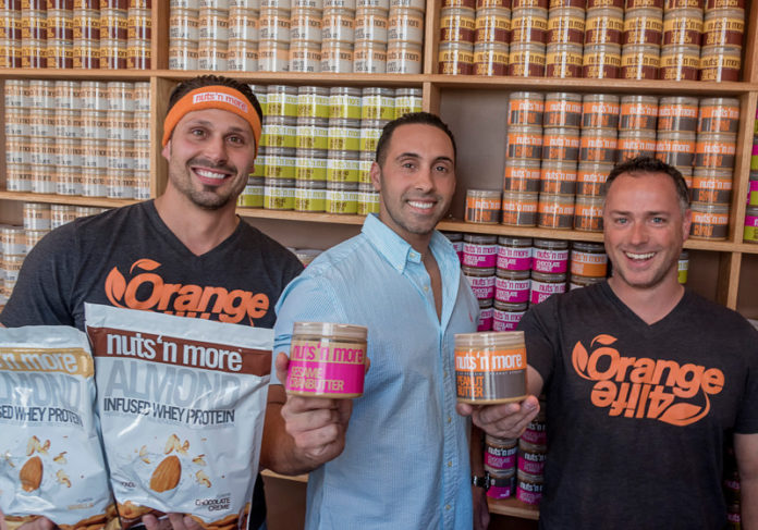 NOT SO NUTS: Yes, it had help from "Shark Tank" financiers Mark Cuban and Robert Herjavec, but Pawtucket-based Nuts 'N More has proven to be a successful venture since its creation in 2010. Pictured in 2015, from left, are Nuts 'N More partners Dennis Iannotti, Peter Ferreira and Neil Cameron. / PBN FILE PHOTO/MICHAEL SALERNO