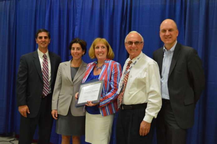 FROM LEFT TO RIGHT, Mario Andrade, Bristol Warren superintendent; Gov. Gina M. Raimondo; Rockwell School Principal Tara McAuliffe; John P. Saviano, Bristol Warren School Committee member; and Education Commissioner Ken Wagner are shown at a ceremony recognizing Commended Schools on Tuesday. The Rockwell School has received the designation four years in a row; it was one of 17 schools honored. / COURTESY R.I. DEPARTMENT OF EDUCATION