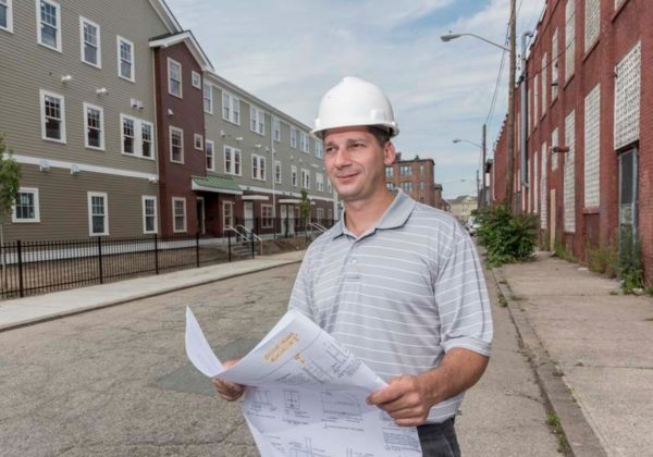 DEMAND EXCEEDING SUPPLY: Kevin Beaulieu, lead project architect for O'Hearne Associates architects, is seen at the Sankofa Apartments construction site on Dexter Street in the West End in Providence. Sankofa is a $15 million scattered-site project to create low-income rental units and a community center. / PBN PHOTO/MICHAEL SALERNO