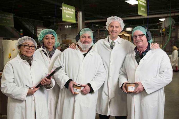 A FAMILY FEEL: Blount Fine Foods President Todd Blount, second from right, makes an effort to stay close to the food manufacturer's product lines and the people who work with them. / COURTESY BLOUNT FINE FOODS