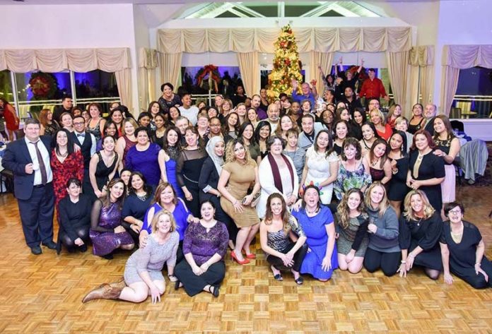 BIG GROUP, PERSONAL TOUCH: Children's Friend managers work at making sure its diverse staff at multiple sites are united through group events, like the staff holiday party. / COURTESY CHILDREN'S FRIEND