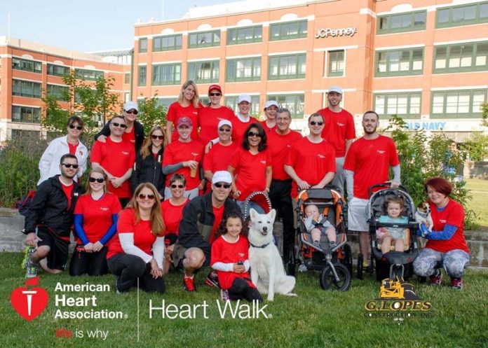 THE EXTRA MILE: Hinckley Allen & Snyder staff engage with one another outside the workplace, including the American Heart Association's Heart Walk in 2015. / COURTESY HINCKLEY ALLEN & SNYDER