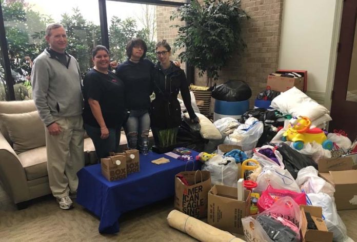 A BENEFIT OF CLEANING: Baystate Financial's Rhode Island office held its Spring Cleaning Event in May to benefit Big Brothers Big Sisters of the Ocean State. / COURTESY BAYSTATE FINANCIAL