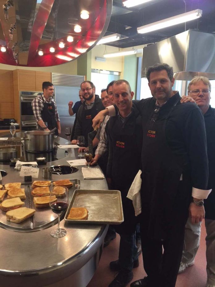 RECIPE FOR SUCCESS: Taking part in a cook-off are, second from right, Chairman and CEO Scott E. DePasquale, third from right, Vice President, Product Development Jeffrey Collemer. / COURTESY UTILIDATA