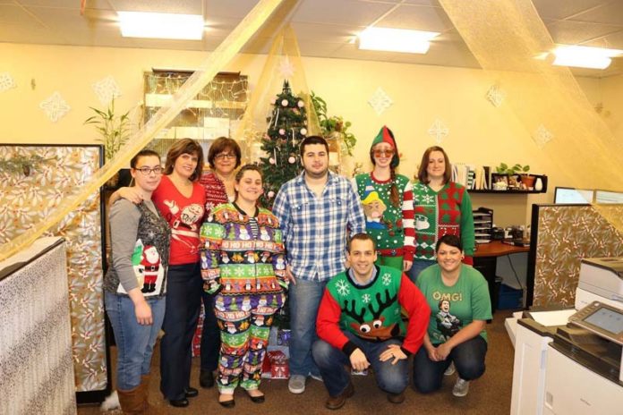 TAILORED TO PLEASE: Brokers' Service Marketing Group works hard to satisfy its staff's needs, including donning unusual holiday clothing for an office gathering. / COURTESY BROKERS' SERVICE MARKETING GROUP