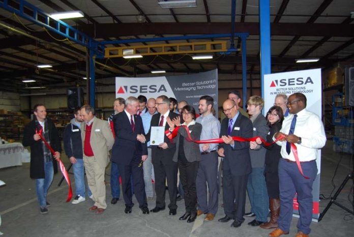 SIGN OF THE TIMES: In January 2015, SES America moved into a larger manufacturing facility in Warwick. Mayor Scott Avedisian attended the ribbon-cutting. / COURTESY SES AMERICA