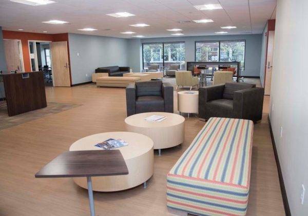 FORM AND FUNCTION: In the new student lounge, comfortable chairs and benches await students. The lounge facility is surrounded by eight classrooms for the School of Continuing Studies and has several charging stations for wireless devices.
