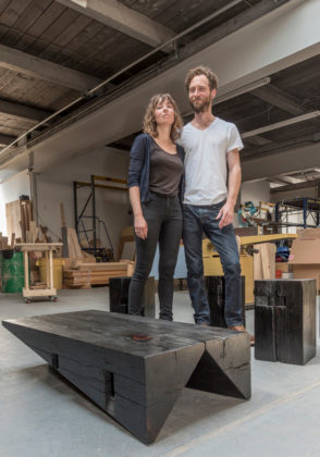 CREATIVITY IGNITED: Anastasia Laurenzi and Michael Larsen are partners in Oblique Studios LLC. Some of their creations include the scorched-wood coffee table in front of them and a Southern yellow pine bench, below. / PBN PHOTOS/MICHAEL SALERNO
