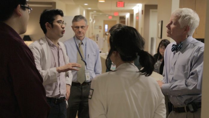 Dr. Ed Martin of Hope Hospice RI and The Warren Alpert Medical School of Brown University talks with medical students about patient care at the Philip Hulitar Hospice Center Providence. / COURTESY HOPE HOSPICE RI