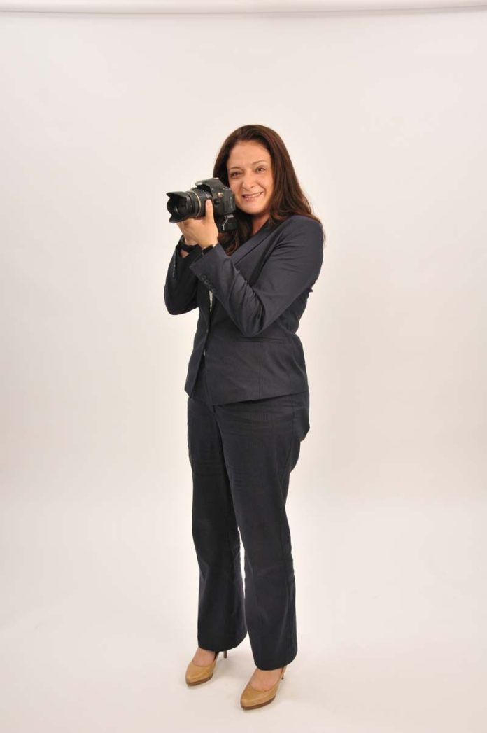The prop: With her camera in tow, Sandy F. Ross enjoys photography in her free time.