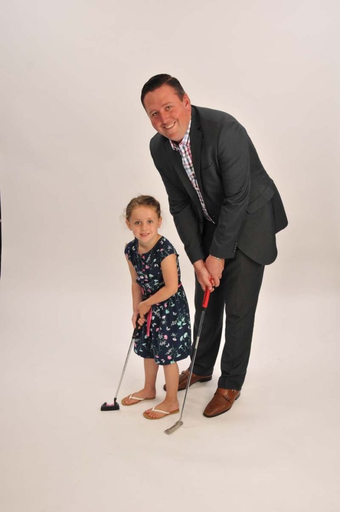 The Prop: Matthew R. Wischnowsky spends his free time with his 5-year-old daughter, Emma, and putting on the green.