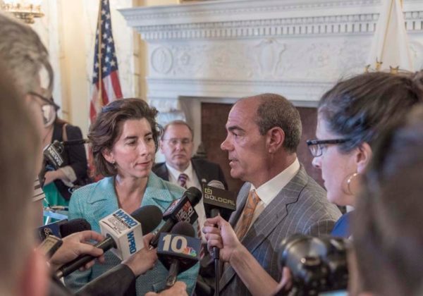 WELCOME SIGHT: Gov. Gina M. Raimondo and Jeffrey S. Bornstein, senior vice president and chief financial officer for General Electric Co., answer questions in June about the company's plan to bring 100 jobs to Providence. / PBN PHOTO/MICHAEL SALERNO