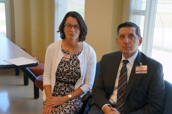 Secretary of the Rhode Island Office of Health and Human Services Elizabeth Roberts and White House Director of National Drug Policy Michael Botticelli are seen before speaking at a press event at a visiting room in the ACI’s women’s prison. / COURTESY NANCY KIRSCH