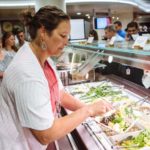 HEALTHY CHOICES: CVS Health Senior Consultant for Wellness Sheri Pensinger takes advantage of the seasonally changing, fresh offerings at a company cafeteria, part of a large set of programs designed to encourage health and well-being. / PBN PHOTO/RUPERT WHITELEY