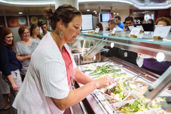 HEALTHY CHOICES: CVS Health Senior Consultant for Wellness Sheri Pensinger takes advantage of the seasonally changing, fresh offerings at a company cafeteria, part of a large set of programs designed to encourage health and well-being. / PBN PHOTO/RUPERT WHITELEY