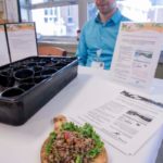Multifaceted wellness effort FOOD FOR THOUGHT: Offerings at South County Health's cafeteria are designed to support wellness efforts. This day a food tasting of citrus-spiced lentil salad was offered by Rob Fancher, a diet and nutrition intern from Johnson & Wales University. / PBN PHOTO/MICHAEL SALERNO