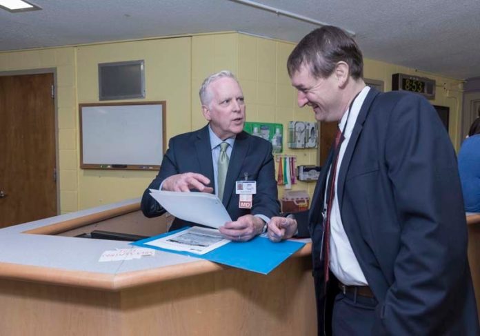 new  approach: From left, Dr. James Sullivan, Butler Hospital's chief medical officer, and Ian Lang, executive director of Continuum Behavioral Health, are seen at Butler Hospital in Providence. / PBN PHOTO/ MICHAEL SALERNO