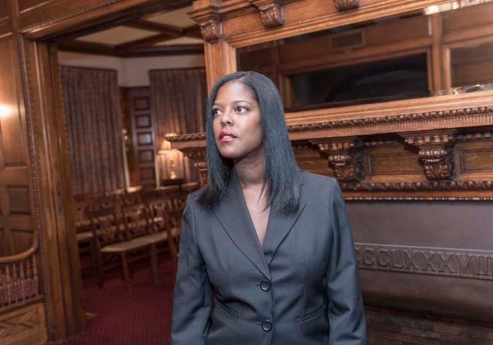 SENSITIVE BUSINESS: Christine M. Cardoza took over the family business, Bell Funeral Home Inc., in 2000, which makes her, she believes, the only African-American woman to be licensed as a funeral home director in Rhode Island. / PBN PHOTO/MICHAEL SALERNO