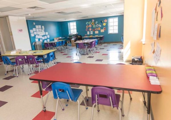 GREAT OPTIONS: The two classrooms shown here can accommodate 25 students in each, or 50 combined when the acoustical wall is pulled back. They feature new flooring and brightly painted walls.