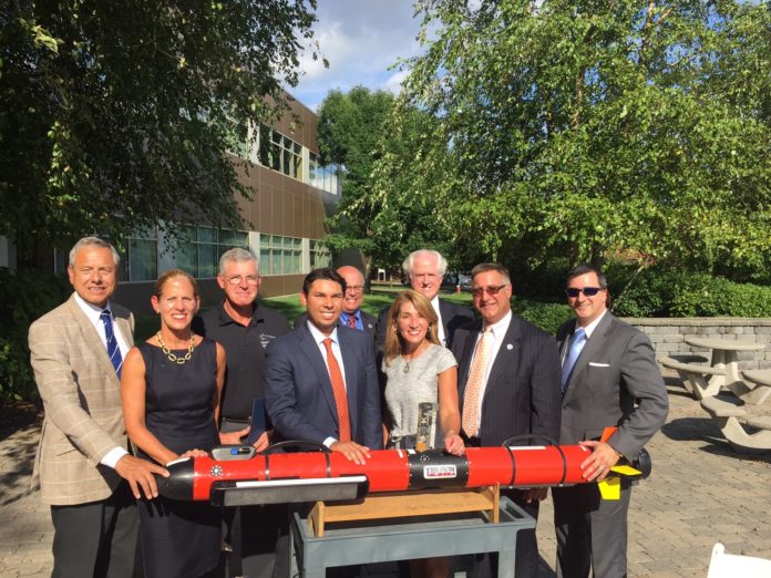 MASS. LT. GOV. KARYN POLITO, third from right, joined UMass Dartmouth officials and elected officials last week in celebrating the graduation of Ocean Server Technology from the university’s Center for Innovation and Entrepreneurship. / COURTESY UMASS DARTMOUTH