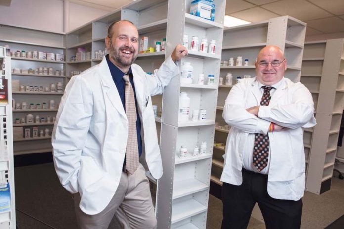 MAKING TIES: Pharmacists Erik Johnson, left, and Richard Ploude have opened Anawan Drug in Rehoboth, an independently owned drugstore. / PBN PHOTO/RUPERT WHITELEY