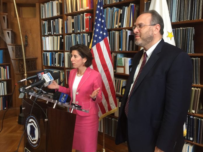 GOV. GINA M. Raimondo and R.I. Commerce Secretary Stefan Pryor talk at a press conference in June about General Electric Co.'s plan to open a GE Digital information technology center in the city. / PBN FILE PHOTO/ELI SHERMAN