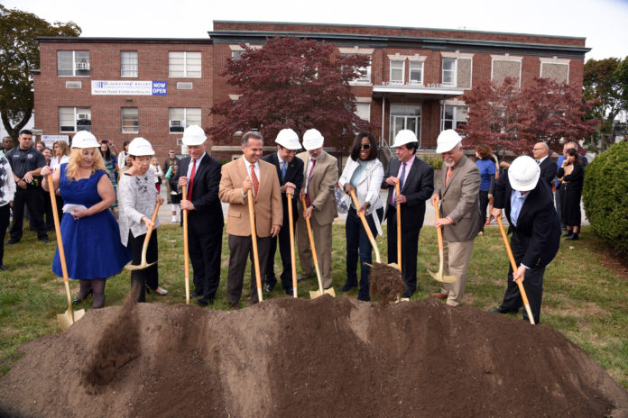 AT THE OCT. 8 GROUNDBREAKING, from left, are: patient Melanie Slivka, Rhode Island Health Center Association President and CEO Jane Hayward, Neighborhood Health Plan of RI CEO Peter Marino, U.S. Congressman David Cicilline, Central Falls Mayor James A. Diossa, Blackstone Valley Community Health Center Senior Clinical and Population Health Officer Michael Fine, Emmy-Award-winning actress and former Central Falls resident Viola Davis, BVCHC Executive Director Raymond Lavoie, Dr. Pablo Rodriguez and R.I. Foundation President and CEO Neil Steinberg. / PHOTO BY STEPHEN SPENCER