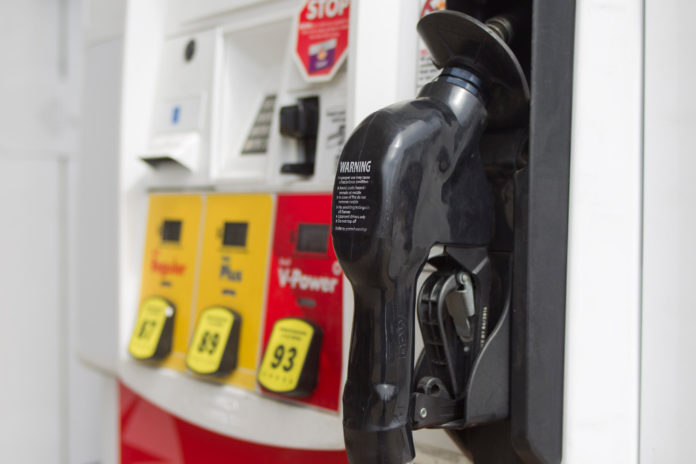 GASOLINE PRICES fell in Rhode Island and Massachusetts, according to AAA Northeast's weekly survey. / BLOOMBERG FILE PHOTO/ANDREW HARRER
