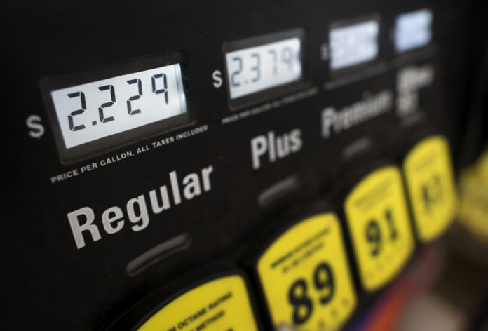 AAA Northeast said gas prices rose 2 cents in Rhode Island to $2.21 per gallon for self-serve, unleaded regular.  / BLOOMBER NEWS FILE/TY WRIGHT