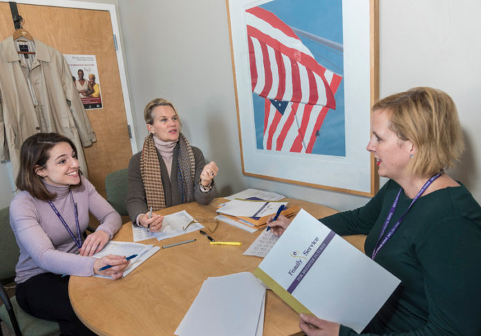 MEETING A NEED: Family Service of Rhode Island staffers discuss fundraising plans. From left, Sarah Anzevino, advancement assistant; Johnnie Chace, director of philanthropy and Maggie Slane, director of advancement and business development. / PBN PHOTO/ MICHAEL SALERNO