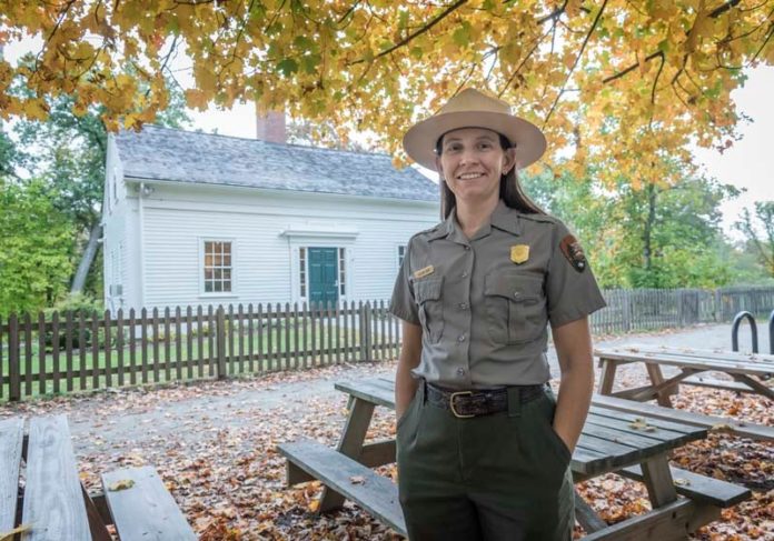 HISTORIC HOUSE: Meghan Kish, superintendent of three national parks in Rhode Island and southeastern Massachusetts, stands in front of the Captain Wilbur Kelly House at the Blackstone River State Park in Lincoln. / PBN PHOTO/MICHAEL SALERNO
