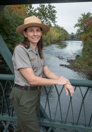 KEEPING WATCH: Meghan Kish, superintendent of three national parks in Rhode Island and southeastern Massachusetts, with the Blackstone River State Park in Lincoln in the background. / PBN PHOTO/MICHAEL SALERNO
