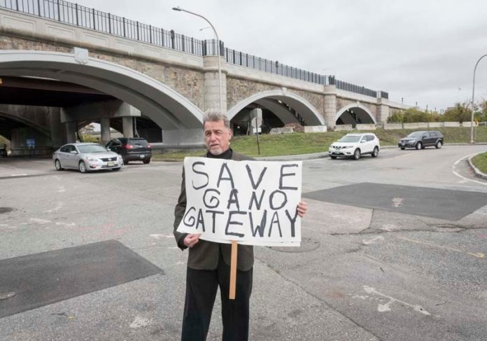 SAVE GANO: Fox Point Neighborhood Association Executive Secretary John Rousseau during a recent protest. The association is trying to get the state to restore up to $1.9 million to create a new "Gateway" to Providence in this area of Point Street and Gano Street. / PBN PHOTO/ MICHAEL SALERNO