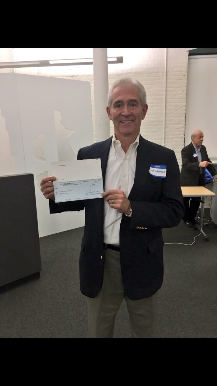 JAMES WAGNER, CEO of BI Medical in North Kingstown, holds the $250 check that he received for winning the Rhode Island Business Plan Competition’s annual statewide Elevator Pitch Contest Tuesday night. Wagner pitched a product that promotes comfort for people who need to wear prosthetics. / COURTESY MATERIALSCIENCE.ORG