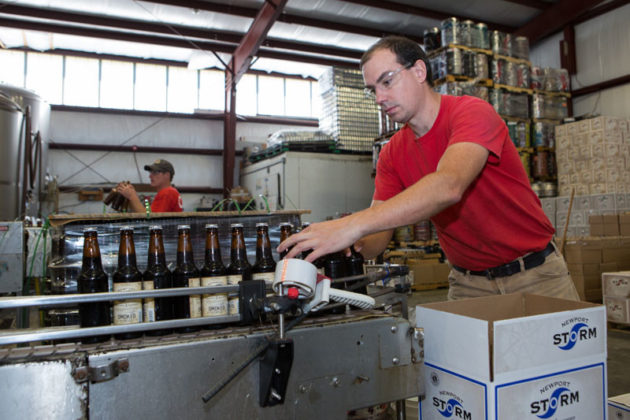 STAYING FOCUSED: Brent Ryan, co-founder and president of Newport Storm Brewery, packs beer. While Newport Storm will continue to focus on selling to distributers, he said the new &quot;pro-brewer&quot; legislation creates a path to existence for smaller brewers in the industry. / PBN FILE PHOTO/ KATE WHITNEY LUCEY