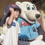 NATURALLY ENGAGED: Pawtucket Red Sox's Paws pals it up with Noah Minucci, 8, of Cranston at the Whole Foods store there to benefit the Whole Kids Foundation, which has the goal of improving nutrition for children. / PBN PHOTO/MICHAEL SALERNO