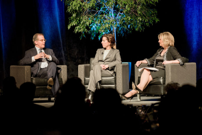 PROVIDENCE EQUITY PARTNERS founder and CEO Jonathan M. Nelson, Gov. Gina M. Raimondo, center, and Greater Providence Chamber of Commerce President Laurie White talk about Rhode Island's business climate, its improving standing among the states and entrepreneurship during the chamber's annual meeting, held Monday evening. / COURTESY ERICK BROWN PHOTOGRAPHY LLC