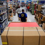 AN EMPLOYEE pulls a forklift with display units for DVD movies at a Wal-Mart Stores Inc. location ahead of Black Friday in Los Angeles in this file photograph. / BLOOMBERG NEWS FILE/PATRICK T. FALLON