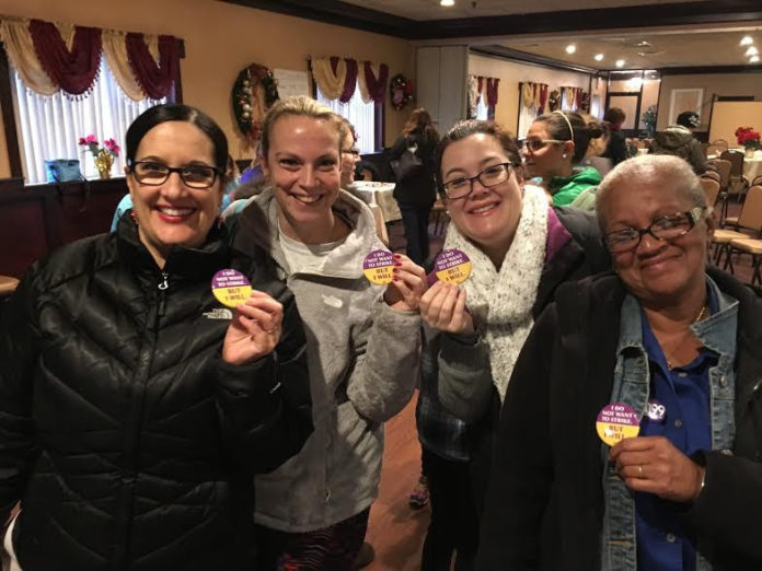BUTTONS WORN by Women & Infants Hospital employees, members of District 1199 SEIU NE, reflect their opinion about a potential strike, after union members voted to approve a strike. / COURTESY 1199 SEIU NE