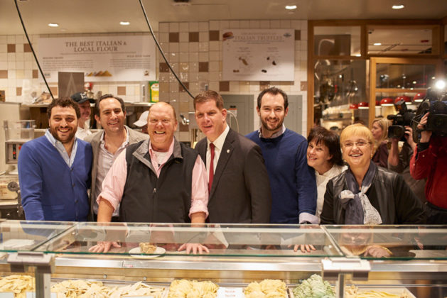 MANGIA: Eataly U.S. CEO Nicola Farinetti, left, joins celebrity chef Mario Batali and Boston Mayor Marty Walsh, third and fourth from left respectively, and others at the opening of Eataly Boston last month. / COURTESY HEATH ROBBINS